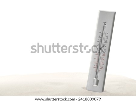 Weather thermometer in sand against white background Royalty-Free Stock Photo #2418809079