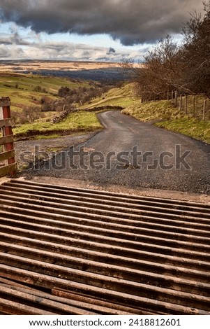 View looking north towards Wensleydale across West Burton from the cattle grid on the single tracked road to Walden in North Yorkshire