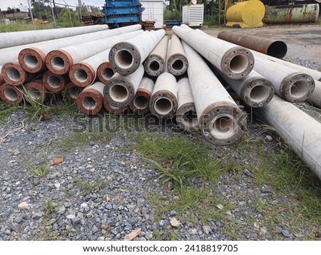 industrial concrete staked pile or spun pile for construction foundation.   Concrete Pile for Foundation of Building. construction foundation work Royalty-Free Stock Photo #2418819705