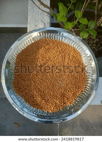 Fenugreek seeds (Uluhal) close up picture. A herb widely used in cooking