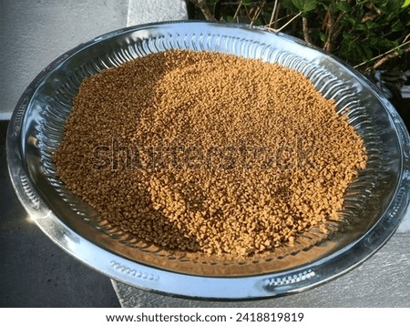 Fenugreek seeds (Uluhal) close up picture. A herb widely used in cooking