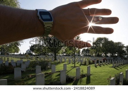 Photographed against the light of the Canadian War Cemetery of Bény-sur-Mer, I am putting my hand to block the sun and it makes a star effect
