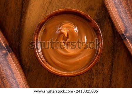 Dulce de leche bowl isolated on white	