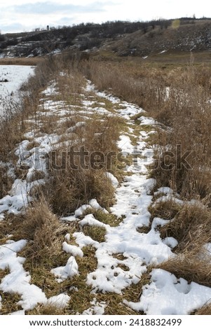 A river with snow on the banks