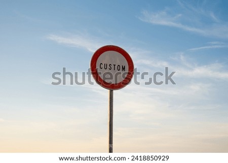 Passing without stopping prohibited customs traffic sign writing English, isolated sunset sky.