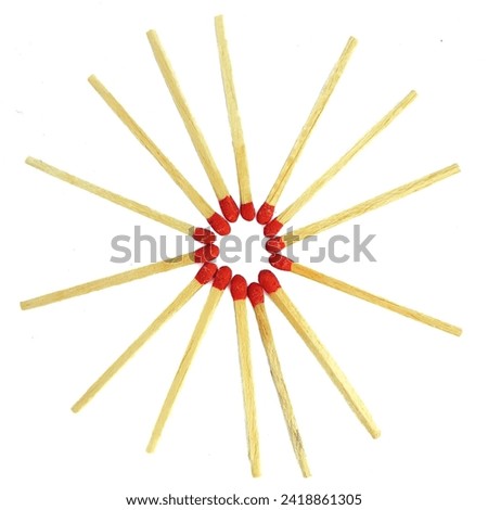 Close-up of a red matchstick arranged in round shape in white background. Wooden match stick kept in circle. Sulphur. Pile of a matchstick in white background. Red match stick. Head of a matchstick. Royalty-Free Stock Photo #2418861305