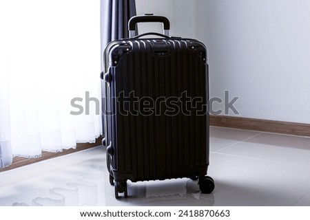 Black travel bag,Luggage or suitcases in modern hotel during check-in It's time to travel, service, travel, summer vacation and vacation concept