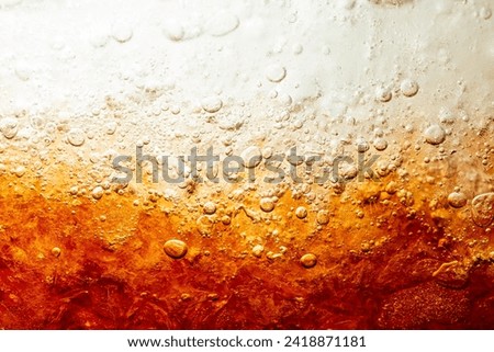 close-up cola background,Cola and Ice, food background, Cola close-up, design element. Beer. Macro bubbles, ice, bubbles, background, ice cubes, abstract background. Royalty-Free Stock Photo #2418871181