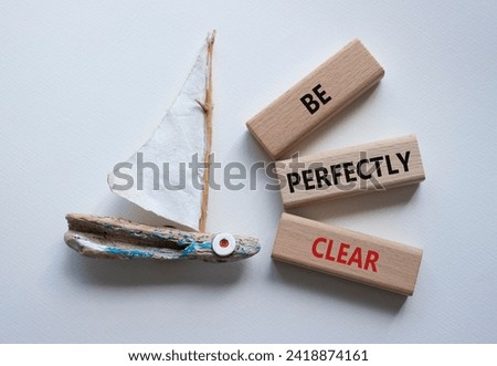 Be perfectly clear symbol. Concept words Be perfectly clear on wooden blocks. Beautiful white background with boat. Business and Be perfectly clear concept. Copy space Royalty-Free Stock Photo #2418874161