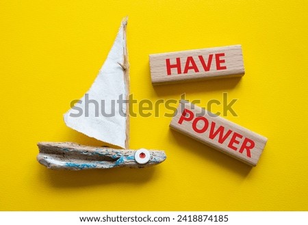 Have power symbol. Wooden blocks with words have power. Beautiful yellow background with boat. Business and have power concept. Copy space.