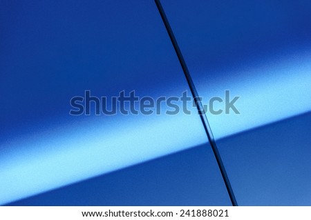 Fragment of blue steel car body. Vehicle paint coating texture. Abstract. Royalty-Free Stock Photo #241888021
