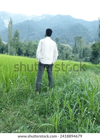 Self made pic myself through my mobile phone,good  looking scenery around myself that is amazing in grass field 