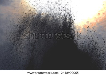 A large amount of water from the fountains rises to the sky. Wet spray waterfall background.