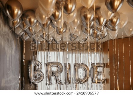 helium bride lettering and white and gray flying balloons. stock photo