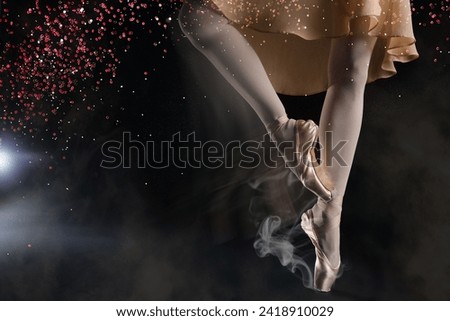 Perfection in ballet. Woman dancing in pointe shoes on black background, closeup. Motion effect with smoke and glitter Royalty-Free Stock Photo #2418910029