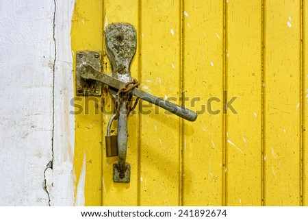 Dirty old closed doors latch.