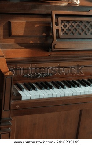 Piano at sunset. Vintage upright piano