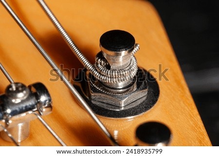 guitar headstock tuning post macro closeup Royalty-Free Stock Photo #2418935799