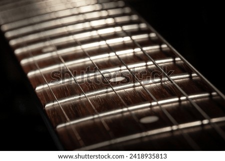 electric guitar fretboard macro closeup Royalty-Free Stock Photo #2418935813