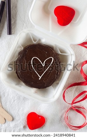 Korean style shocolate bento cake on light background.  Cake for Valentine's Day, Mother's Day, or Birthday, Love Forever Message, Romantic Bento Cake for Two