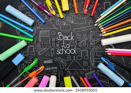Back to school blackboard with school office supplies. Education background.