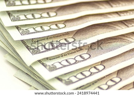 Background of 100 dollar. Macro, close-up money. Lots of 100 dollar bills, the concept of US cash money. US paper. Bribery with a wad of money, cash circulation and money exchange currency Royalty-Free Stock Photo #2418974441