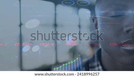 Image of financial data processing over smiling african american businessman in office. Global finance, business, connections, computing and data processing concept digitally generated image.
