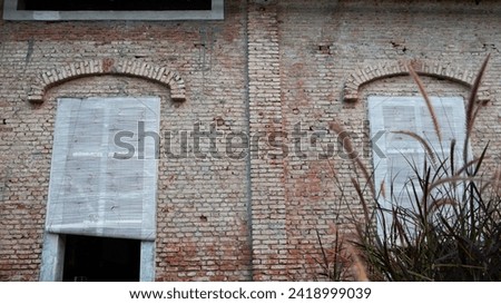 wide window design with red brick walls of the Dutch historical heritage building of the Javanese sugar factory