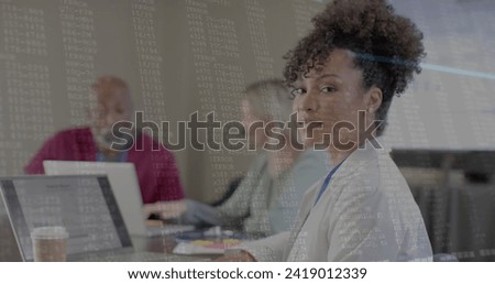 Image of financial data processing over diverse business people in office. Global finance, business, connections, computing and data processing concept digitally generated image.