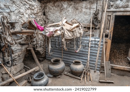 Pictures from Balti Heritage home and Museum, display the village home, century-old utensils, horse saddle, and vibrant clothing of the Ladakhi people. The old mud house was constructed 140 years ago.