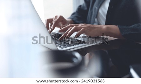 Businesswoman hands typing on laptop computer keyboard, online working at modern workplace. Woman surfing the internet on laptop, working remotely at home office, teleworking, distant job Royalty-Free Stock Photo #2419031563