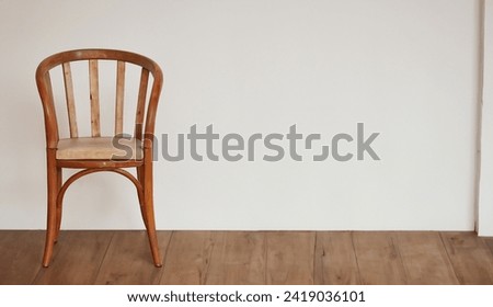wooden chair on a wall
