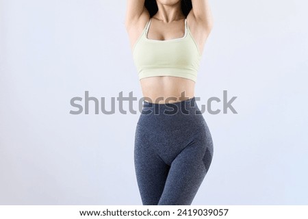Toned female body doing training