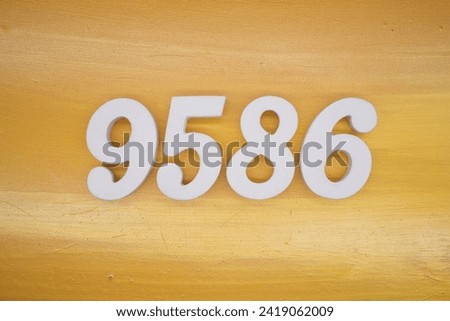 The golden yellow painted wood panel for the background, number 9586, is made from white painted wood.