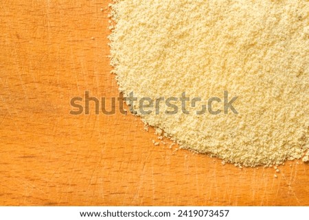 Chicken broth powder on wood background. Chicken stock. Top view.