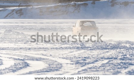 Car got stuck in snow, snow drift and sweep on road.
