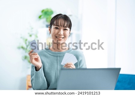 A woman worried about credit cards Royalty-Free Stock Photo #2419101213