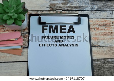 Concept of FMEA - Failure Modes and Effects Analysis write on paperwork isolated on wooden background. Royalty-Free Stock Photo #2419118707