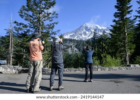 People taking photos of Mt Rainier using smartphones. Skyline Loop Trail in Mount Rainier National Park. Washington State. Royalty-Free Stock Photo #2419144147