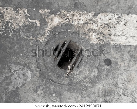 manhole safety sewer metal cover on concrete. drainage and sewage system use this circle metal cover