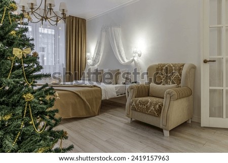 Nordic, cozy living room interior with a Christmas tree, wite tones, coffee table, and sofa.