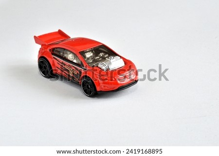 Top view of a children's toy, a red car.