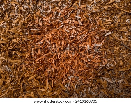 The texture of brown wood chips is stacked so that it looks good