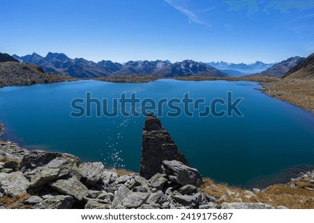 Dolomites on the horizon above Oberseitsee in Osttirol Royalty-Free Stock Photo #2419175687
