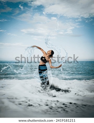 An image I designed on Photoshop, in which girls dance among the waves and express life