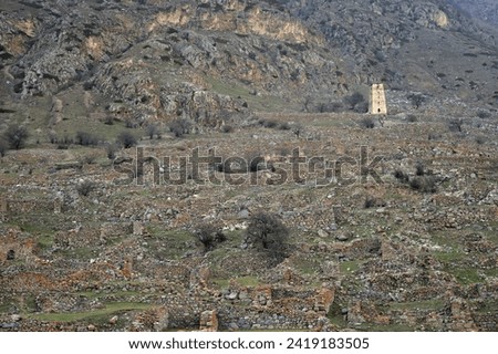 Abaev Tower, defensive structure of late Middle Ages in village of Kyunnyum, destroyed after deportation of Balkar people in spring, village of Upper Balkaria, Kabardino-Balkarian Republic, Russia Royalty-Free Stock Photo #2419183505