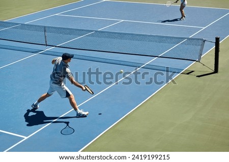 Sport, people and tennis on court with game, competition and performance outdoor with fitness and energy. Athlete, player and ball on turf for training, exercise and racket with fun, action and hobby Royalty-Free Stock Photo #2419199215