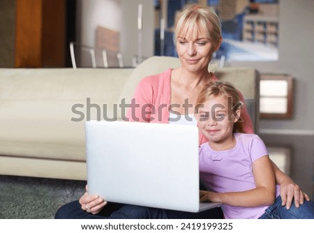 Mother, child and relax by laptop on living room floor, happy and stream subscription in apartment. Daughter, woman and smile on computer by online cartoon, technology and connected on couch in house