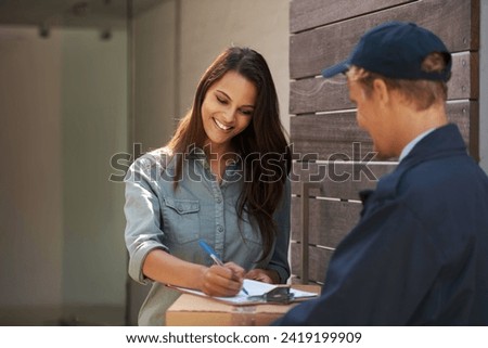 Doing it the easy way. Shot of a young woman signing for a delivery. Royalty-Free Stock Photo #2419199909