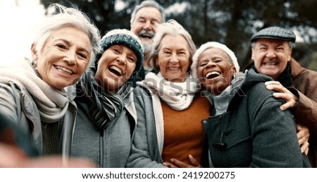 Happy, selfie and senior friends in a park while walking outdoor for fresh air together. Diversity, smile and group of elderly people in retirement taking picture and bonding in a forest in winter.